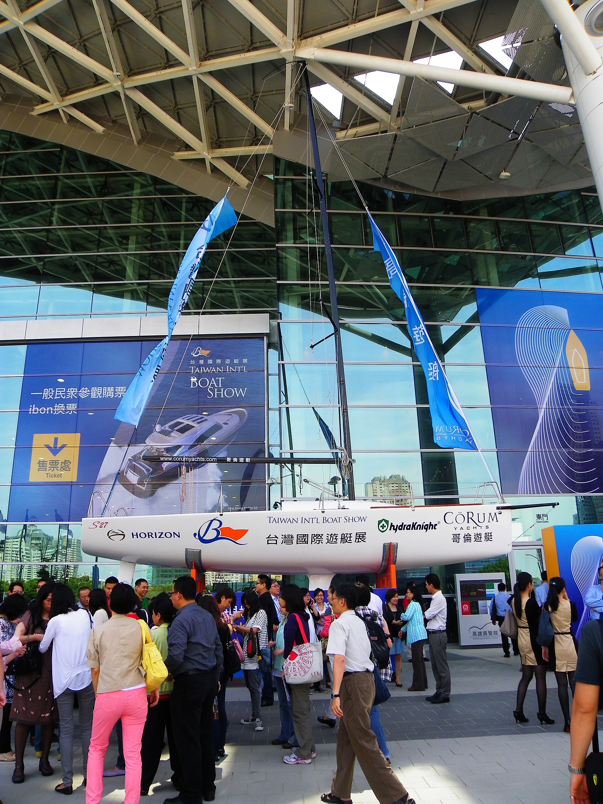 A modern sailing yacht displayed outside the Kaohsiung Exhibition Center