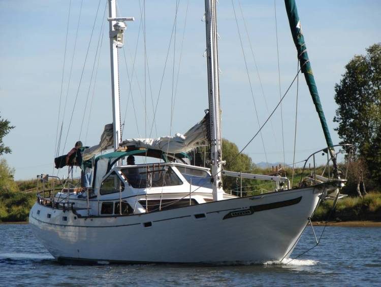 Under diesel power, sails furled